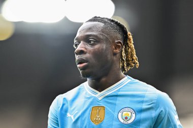 Manchester City 'den Jrmy Doku, Premier League maçı sırasında Manchester City ile Luton Town Etihad Stadyumu, Manchester, İngiltere, 13 Nisan 2024