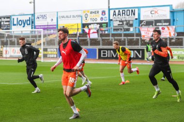 Blackpool oyuncuları, 13 Nisan 202 'de İngiltere, Carlisle, Brunton Park' ta oynanan Sky Bet Lig 1 karşılaşmasında Blackpool 'a karşı oynanan maç öncesi ısınma maçında
