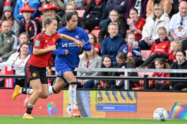 Maya Le Tissier of Manchester United Women and Mayra Ramrez of Chelsea battle for the ball, during the Adobe Women's FA Cup Semi-Final match Manchester United Women vs Chelsea FC Women at Leigh Sports Village, Leigh, United Kingdom, 14th April 2024 clipart