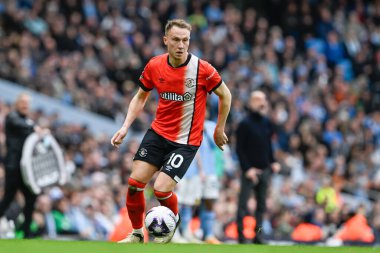 Cauley Woodrow of Luton Town breaks forward, during the Premier League match Manchester City vs Luton Town at Etihad Stadium, Manchester, United Kingdom, 13th April 202 clipart