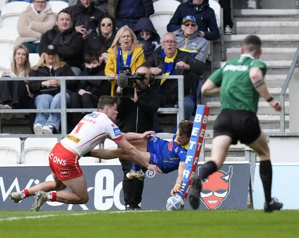 stock image Matty Ashton of Warrington Wolves  dives over the line to score a try during the Betfred Challenge Cup Quarter Final match St Helens vs Warrington Wolves at Totally Wicked Stadium, St Helens, United Kingdom, 14th April 202