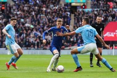 Chelsea 'den Cole Palmer, 20 Nisan 202' de Wembley Stadyumu 'nda Manchester City' nin Chelsea 'ye karşı oynadığı Emirlikler Kupası yarı final maçında Manchester City' den Rodri tarafından oynandı.