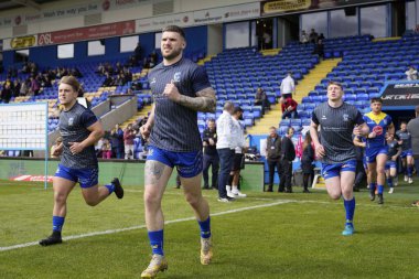 Warrington Wolves 'tan Connor Wrench, 20 Nisan 202' de Halliwell Jones Stadyumu 'nda oynanan Warrington Wolves - Leigh Leopards maçından önce ısınmak için koşuyor.