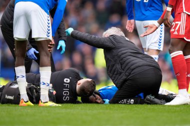 Beto of Everton receives treatment after a collision during the Premier League match Everton vs Nottingham Forest at Goodison Park, Liverpool, United Kingdom, 21st April 202 clipart