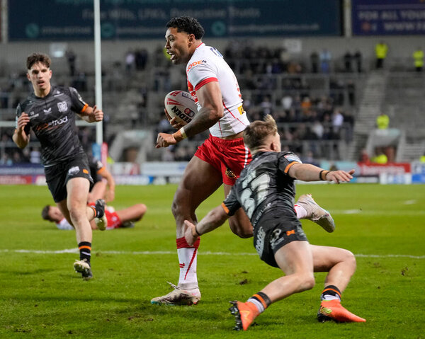 Waqa Blake of St. Helens runs through the Hull FC defence to scores a try during the Betfred Super League  Round 8 match St Helens vs Hull FC at Totally Wicked Stadium, St Helens, United Kingdom, 19th April 202