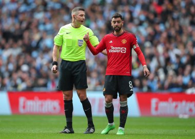 Referee Robert Jones speaks with Bruno Fernandes of Manchester United, during the Emirates FA Cup Semi-Final match Coventry City vs Manchester United at Wembley Stadium, London, United Kingdom, 21st April 202 clipart