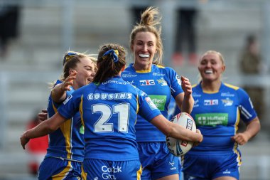 Evie Cousins of Leeds Rhinos celebrates their try during the Betfred Womens Super League Round 1 match Leeds Rhinos Women vs Huddersfield Giants Women at Headingley Stadium, Leeds, United Kingdom, 19th April 2024 clipart