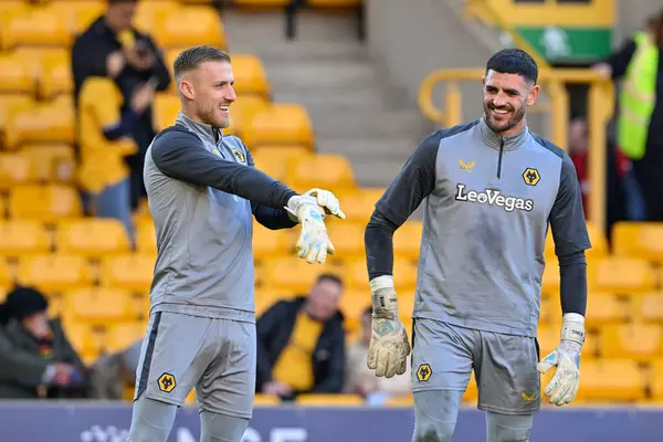 stock image Tom King of Wolverhampton Wanderers and Daniel Bentley of Wolverhampton Wanderers share a joke as they warms up ahead of the match, during the Premier League match Wolverhampton Wanderers vs Arsenal at Molineux, Wolverhampton, United Kingdom, 20th Ap