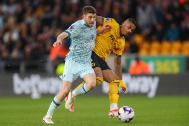 Ryan Christie of Bournemouth holds off Mario Lemina of Wolverhampton Wanderers during the Premier League match Wolverhampton Wanderers vs Bournemouth at Molineux, Wolverhampton, United Kingdom, 24th April 202 clipart