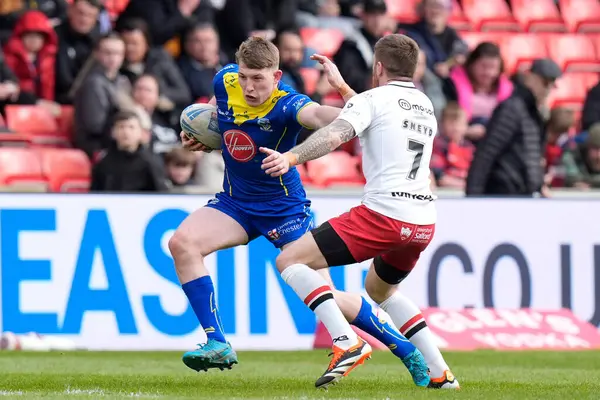 stock image Matty Nicholson of Warrington Wolves hands off Marc Sneyd of Salford Red Devils during the Betfred Super League Round 9 match Salford Red Devils vs Warrington Wolves at Salford Community Stadium, Eccles, United Kingdom, 27th April 202