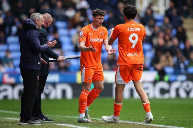 Matty Virtue of Blackpool replaces Kyle Joseph of Blackpool during the Sky Bet League 1 match Reading vs Blackpool at Select Car Leasing Stadium, Reading, United Kingdom, 27th April 202 clipart