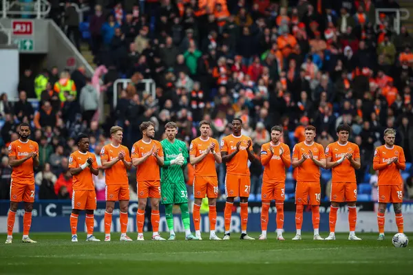 stock image Blackpool players hold a minutes applause during the Sky Bet League 1 match Reading vs Blackpool at Select Car Leasing Stadium, Reading, United Kingdom, 27th April 202