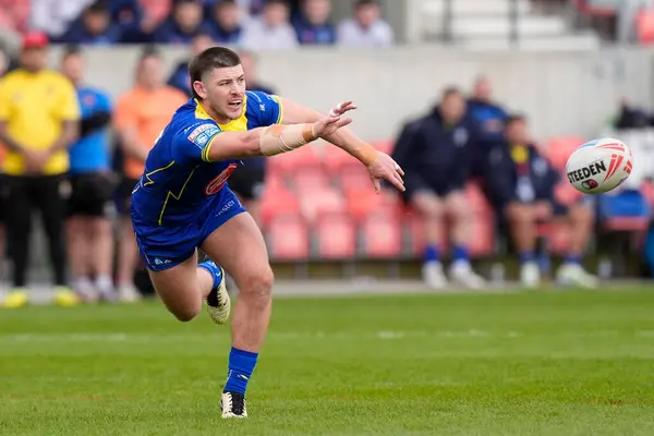 stock image Danny Walker of Warrington Wolves passes the ball during the Betfred Super League Round 9 match Salford Red Devils vs Warrington Wolves at Salford Community Stadium, Eccles, United Kingdom, 27th April 202