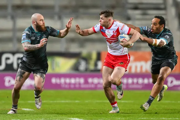 stock image Jack Welsby of St. Helens fends off Jake Bibby of Huddersfield Giants during the Betfred Super League Round 9 match St Helens vs Huddersfield Giants at Totally Wicked Stadium, St Helens, United Kingdom, 25th April 202