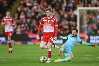 Luca Connell of Barnsley breaks with the ball during the Sky Bet League 1 Promotion Play-offs Semi-final first leg match Barnsley vs Bolton Wanderers at Oakwell, Barnsley, United Kingdom, 3rd May 2024 clipart