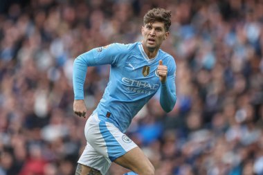 Manchester City 'den John Stones Premier League maçı sırasında Manchester City ile Wolverhampton Wanderers arasında Etihad Stadyumu, Manchester, İngiltere, 4 Mayıs 2024