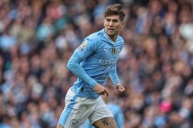Manchester City 'den John Stones Premier League maçı sırasında Manchester City ile Wolverhampton Wanderers arasında Etihad Stadyumu, Manchester, İngiltere, 4 Mayıs 2024