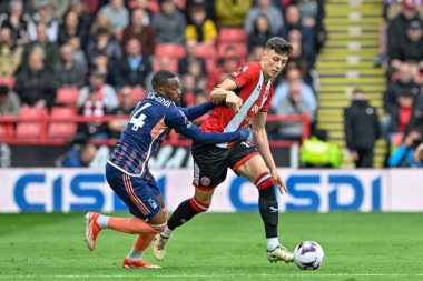 Callum Hudson-Odoi of Nottingham Forest and Anel Ahmedhodi of Sheffield United battle for the ball during the Premier League match Sheffield United vs Nottingham Forest at Bramall Lane, Sheffield, United Kingdom, 4th May 2024  clipart