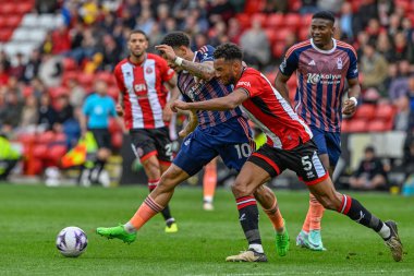 Nottingham Ormanı 'ndan Morgan Gibbs-White ve Sheffield United takımından Auston Trusty Premier League maçı sırasında Sheffield United Nottingham Ormanı' na karşı Bramall Lane, Sheffield, Birleşik Krallık, 4 Mayıs 2024 'te mücadele ettiler. 