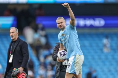 Erling Haaland  of Manchester City collects the ball after scoring 4 goals during the Premier League match Manchester City vs Wolverhampton Wanderers at Etihad Stadium, Manchester, United Kingdom, 4th May 2024 clipart