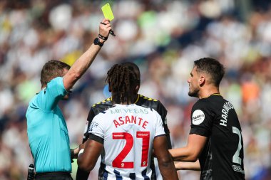 Taylor Harwood-Bellis of Southampton is shown a yellow card by referee Samuel Barrott during  Sky Bet Championship Play-Off Semi-Final First Leg match West Bromwich Albion vs Southampton at Hawthorns, West Bromwich, United Kingdom, 12th May 2024  clipart