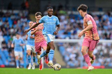 Farid Alfa-Ruprecht breaks forward with the ball, during the FA Youth Cup Final match Manchester City vs Leeds United at Etihad Stadium, Manchester, United Kingdom, 10th May 2024  clipart