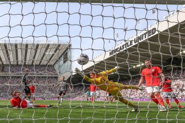 Sean Longstaff of Newcastle United scores past Bart Verbruggen of Brighton & Hove Albion  to make it 1-1 during the Premier League match Newcastle United vs Brighton and Hove Albion at St. James's Park, Newcastle, United Kingdom, 11th May 2024  clipart