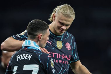 Erling Haaland of Manchester City and Phil Foden of Manchester City embrace after the Premier League match Tottenham Hotspur vs Manchester City at Tottenham Hotspur Stadium, London, United Kingdom, 14th May 2024  clipart