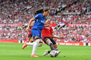 Jayde Riviere of Manchester United Women tackles Mayra Ramrez of Chelsea Women, during the The FA Women's Super League match Manchester United Women vs Chelsea FC Women at Old Trafford, Manchester, United Kingdom, 18th May 2024 