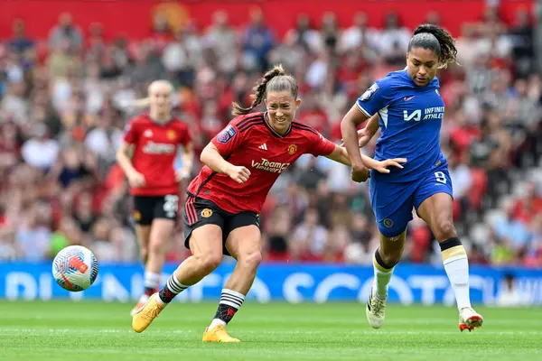stock image Maya Le Tissier passes ball while under pressure from Catarina Macario of Chelsea Women, during FA Women's Super League match Manchester United Women vs Chelsea FC Women at Old Trafford, Manchester, United Kingdom, 18th May 2024 