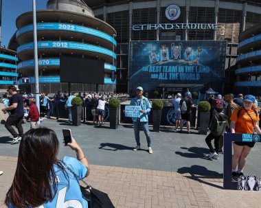 A Man City fan has a selfie holding a home made poster saying hes travel 17006 KM from Sydney to Manchester during the Premier League match Manchester City vs West Ham United at Etihad Stadium, Manchester, United Kingdom, 19th May 2024 