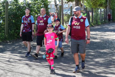 Burnley fans make their way to the stadium ahead of the Premier League match Burnley vs Nottingham Forest at Turf Moor, Burnley, United Kingdom, 19th May 2024