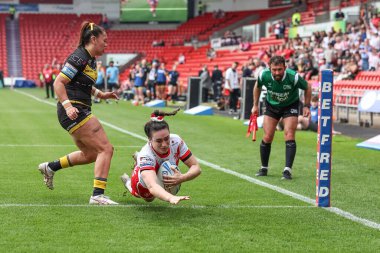 Leah Burke of St Helens goes over for a try during the Betfred Women's Challenge Cup match St Helens Women vs York City Knights Women at Eco-Power Stadium, Doncaster, United Kingdom, 18th May 2024 clipart