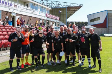 Nottingham Forest fans dressed as referees with masks of referee Stuart Attwell pose for a photo ahead of the Premier League match Burnley vs Nottingham Forest at Turf Moor, Burnley, United Kingdom, 19th May 2024