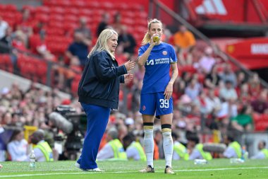 Emma Hayes manager of Chelsea Women speaks with Aggie Beever-Jones of Chelsea Women, during the The FA Women's Super League match Manchester United Women vs Chelsea FC Women at Old Trafford, Manchester, United Kingdom, 18th May 2024 