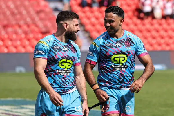 stock image Abbas Miski of Wigan Warriors and Bevan French of Wigan Warriors celebrate their win during the Betfred Challenge Cup Semi-Final Hull KR v Wigan Warriors at Eco-Power Stadium, Doncaster, United Kingdom, 18th May 2024