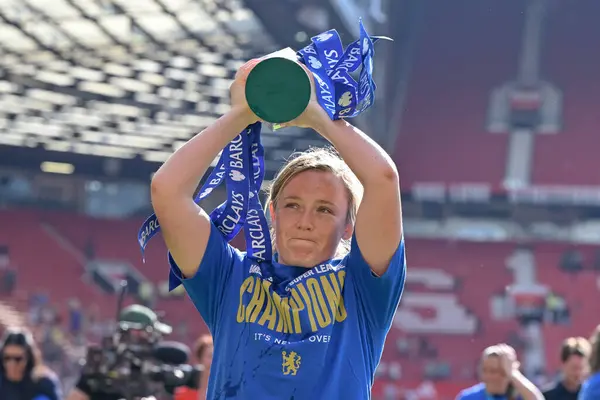 stock image Erin Cuthbert of Chelsea Women lifts The FA Women's Super League title towards the Chelsea fans, during the The FA Women's Super League match Manchester United Women vs Chelsea FC Women at Old Trafford, Manchester, United Kingdom, 18th May 2024 