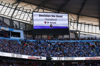 VAR disallows a goal for West Ham as Tom Souek of West Ham United commits handball in the build up to the goal during the Premier League match Manchester City vs West Ham United at Etihad Stadium, Manchester, United Kingdom, 19th May 2024 