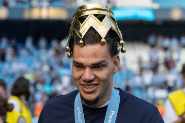Ederson of Manchester City with the Premier League Trophy Crown on his head  during the Premier League match Manchester City vs West Ham United at Etihad Stadium, Manchester, United Kingdom, 19th May 2024 