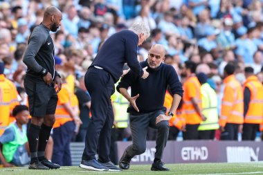 David Moyes manager of West Ham United shakes hands with Pep Guardiola manager of Manchester City at full time after the Premier League match Manchester City vs West Ham United at Etihad Stadium, Manchester, United Kingdom, 19th May 2024 