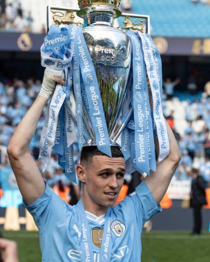 Phil Foden of Manchester City wit the Premier League Trophy during the Premier League match Manchester City vs West Ham United at Etihad Stadium, Manchester, United Kingdom, 19th May 2024 