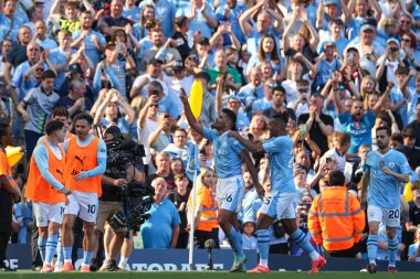 Rodrigo of Manchester City celebrates his goal with his team mates and makes the score 3-1 during the Premier League match Manchester City vs West Ham United at Etihad Stadium, Manchester, United Kingdom, 19th May 2024 