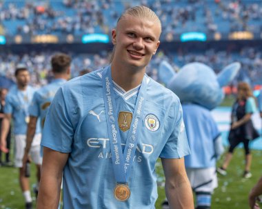 Erling Haaland of Manchester City with his Premier League winners medal during the Premier League match Manchester City vs West Ham United at Etihad Stadium, Manchester, United Kingdom, 19th May 2024 