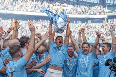 Matheus Nunes of Manchester City lifts the Premier League Trophy during the Premier League match Manchester City vs West Ham United at Etihad Stadium, Manchester, United Kingdom, 19th May 2024 
