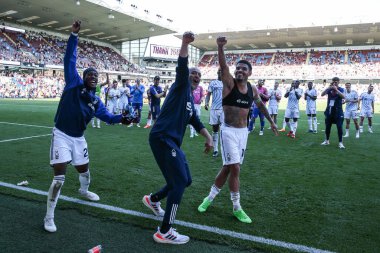 Anthony Elanga, Nuno Esprito Santo and Morgan Gibbs-White of Nottingham Forest celebrate their teams win to guarantee safety after the Premier League match Burnley vs Nottingham Forest at Turf Moor, Burnley, United Kingdom, 19th May 2024