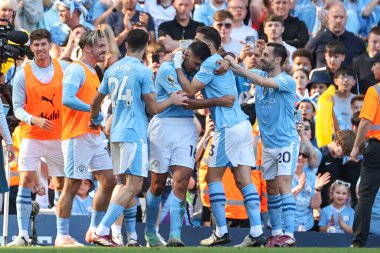 Rodrigo of Manchester City celebrates his goal with his team mates and makes the score 3-1 during the Premier League match Manchester City vs West Ham United at Etihad Stadium, Manchester, United Kingdom, 19th May 2024  