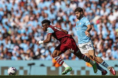 West Ham United 'dan Muhammed Kudus, Manchester City - West Ham United Premier Lig maçı sırasında İngiltere Etihad Stadyumu' nda 19 Mayıs 2024 'te Joko Gvardiol' dan kurtuldu. 