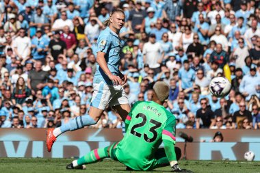 Alphonse Areola of West Ham United saves a shot from Erling Haaland of Manchester City during the Premier League match Manchester City vs West Ham United at Etihad Stadium, Manchester, United Kingdom, 19th May 2024