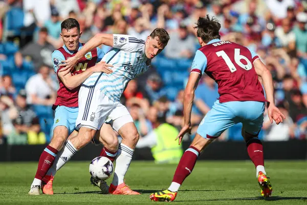 stock image Chris Wood of Nottingham Forest holds off Dara O'Shea of Burnley during the Premier League match Burnley vs Nottingham Forest at Turf Moor, Burnley, United Kingdom, 19th May 2024