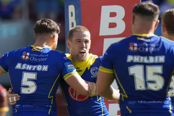stock image Matt Dufty of Warrington Wolves  celebrate his second try of the match during the Betfred Challenge Cup Semi-Final match Huddersfield Giants vs Warrington Wolves at Totally Wicked Stadium, St Helens, United Kingdom, 19th May 2024
